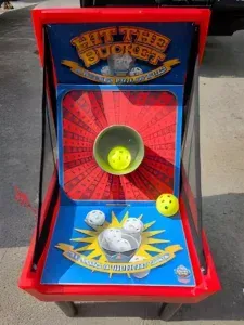 A game called hit the bucket is sitting on the ground