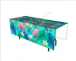 A table cloth with flamingos and flowers on it.