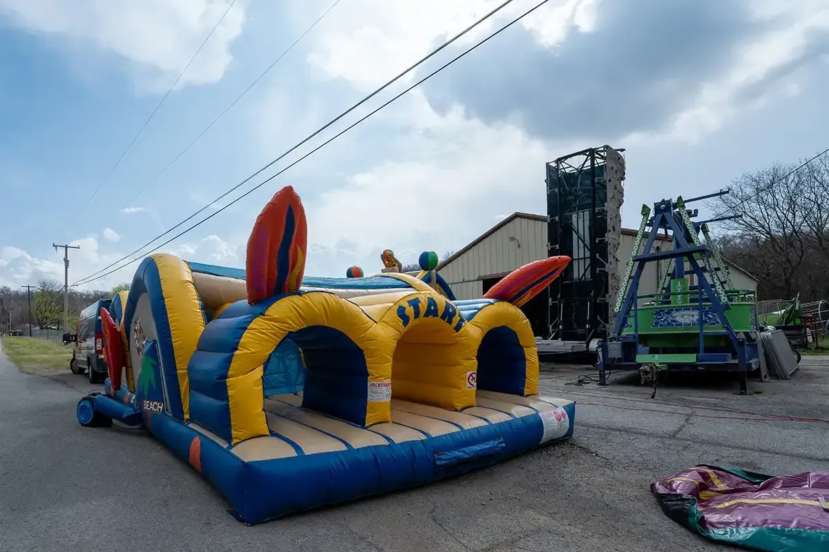 A large inflatable obstacle course is sitting on the side of the road.