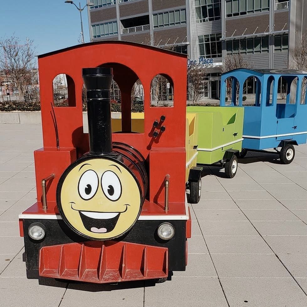 A red train with a smiley face on the front
