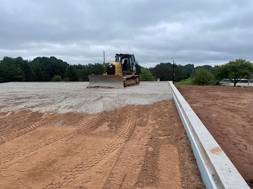 A bulldozer is moving dirt on a construction site.