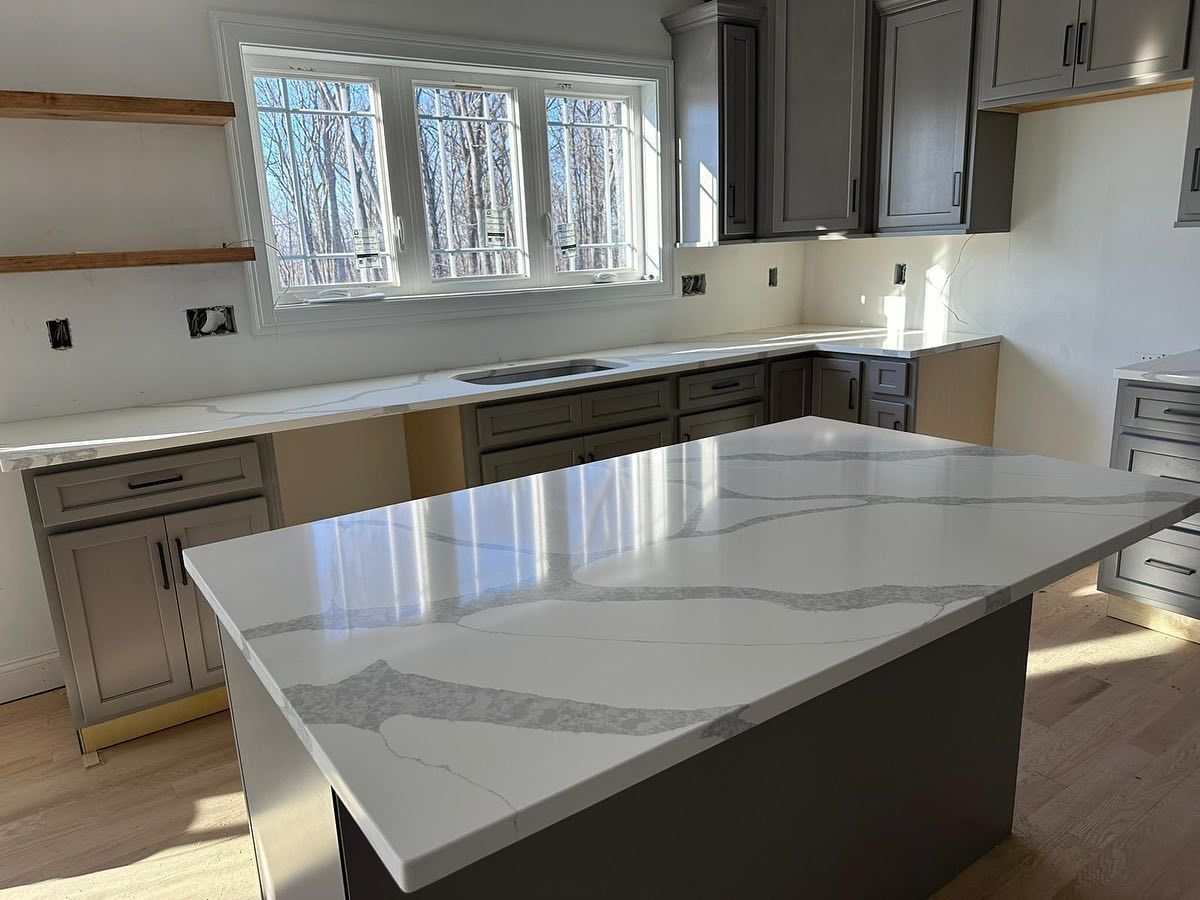 There is a large island in the middle of the kitchen.