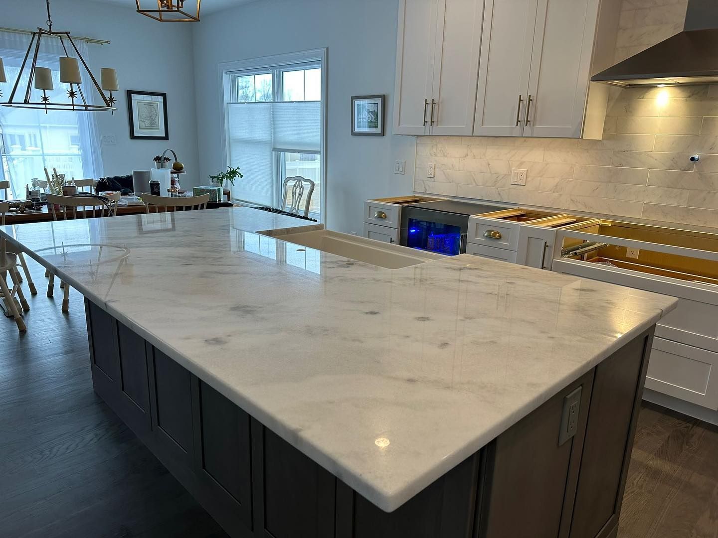 There is a large island in the middle of the kitchen.
