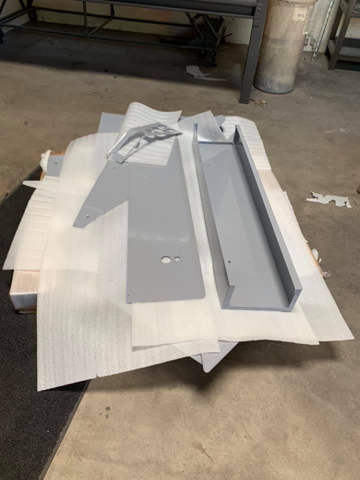 A stack of metal pieces sitting on top of each other on a table.