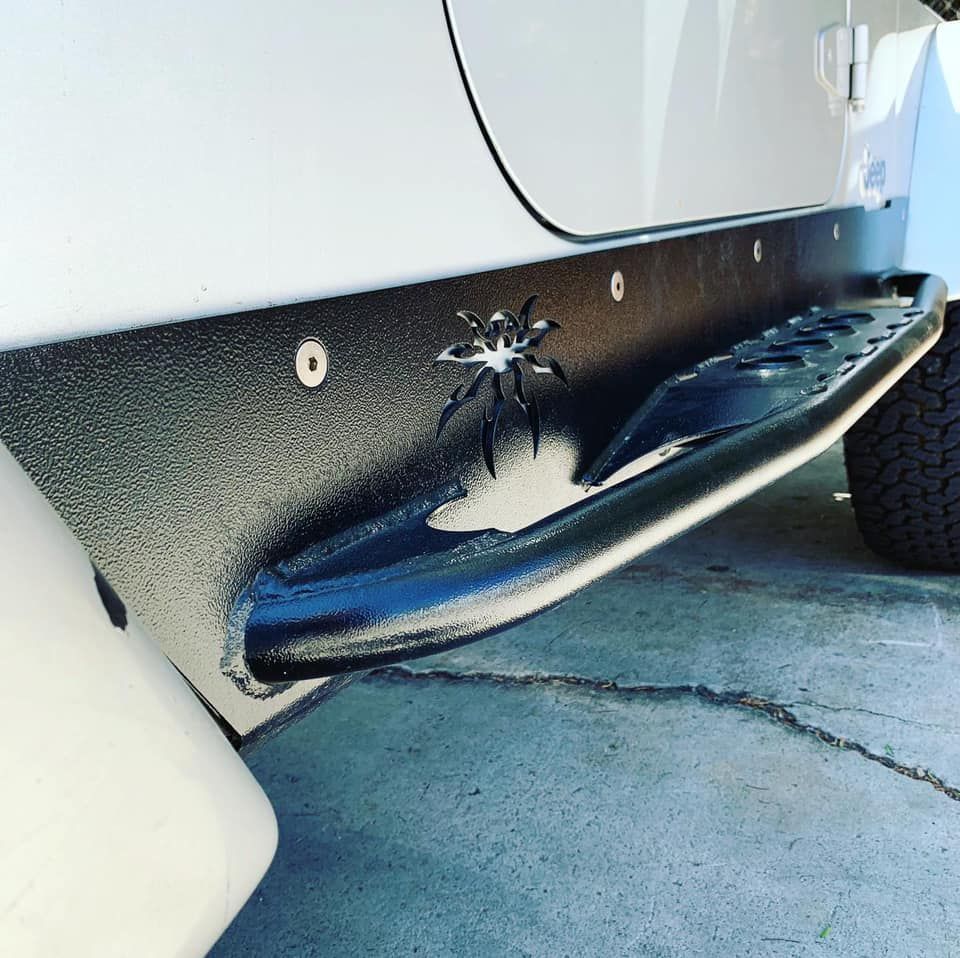 A spider is painted on the side of a vehicle