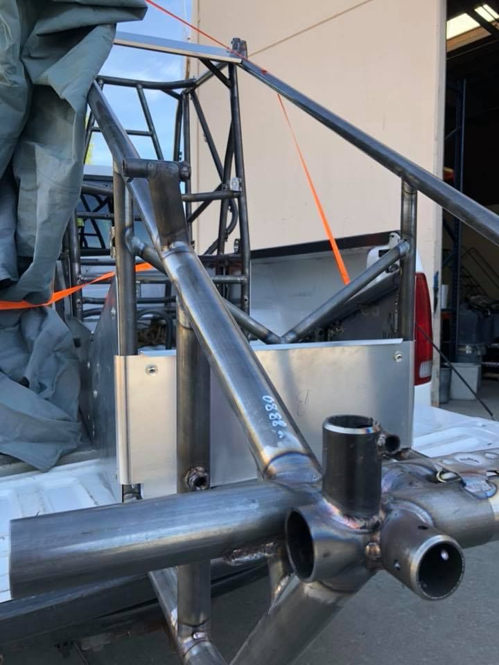A metal structure is sitting on top of a truck bed.