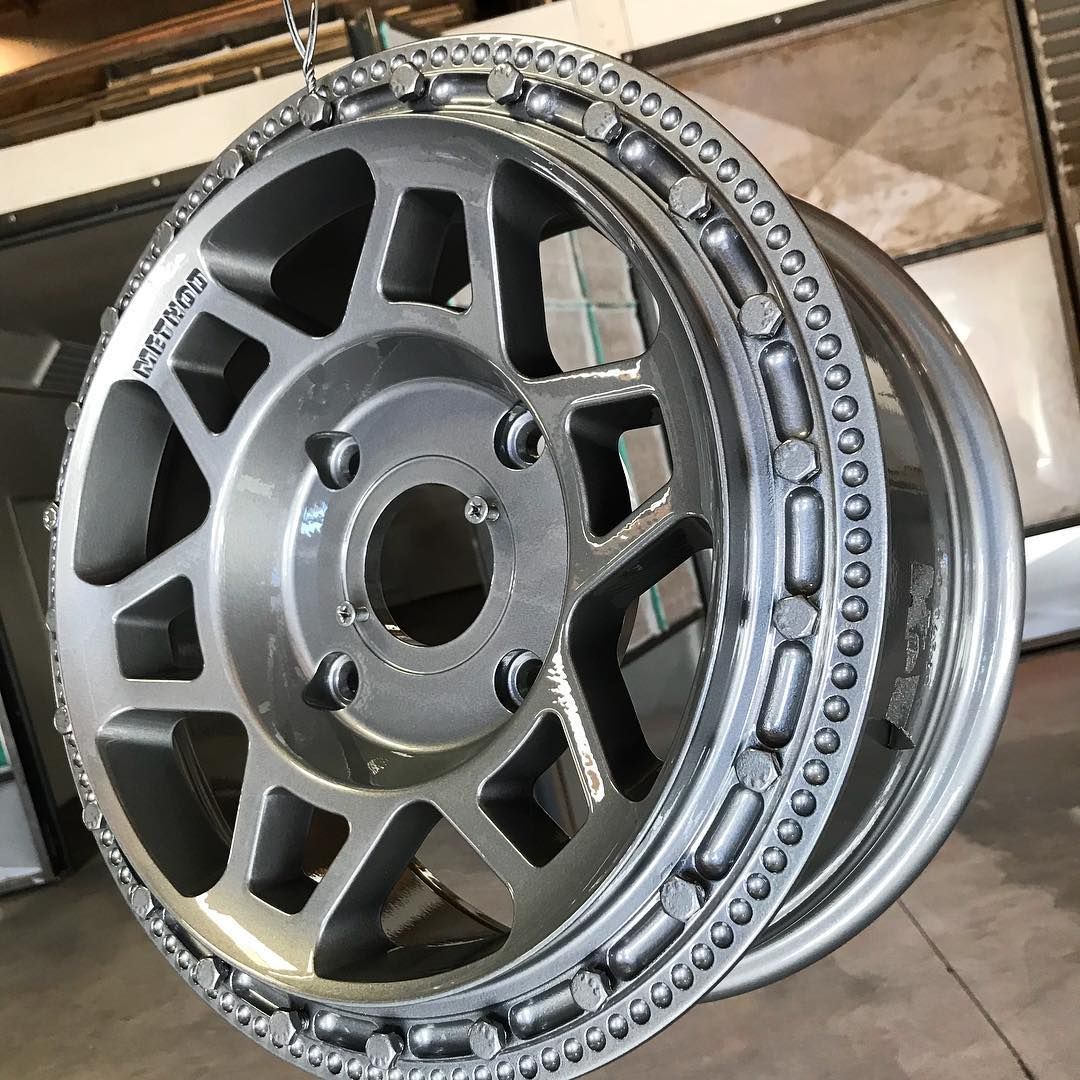 A close up of a wheel sitting on top of a table.