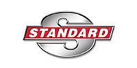 Standard logo in red and white on a metallic gray oval background