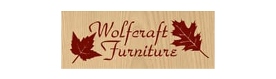Wolffcraft Furniture logo on wood grain background, with two red leaves flanking the company name in cursive.