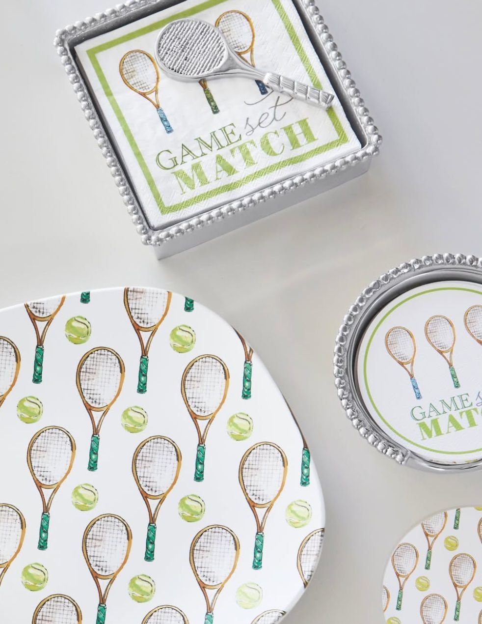 A plate with tennis rackets and tennis balls on it