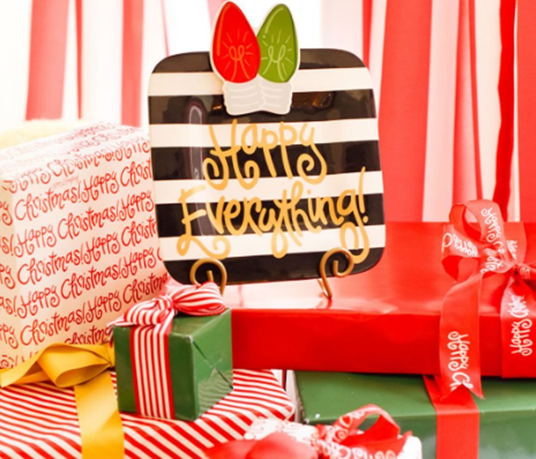 A black and white striped plate that says happy everything