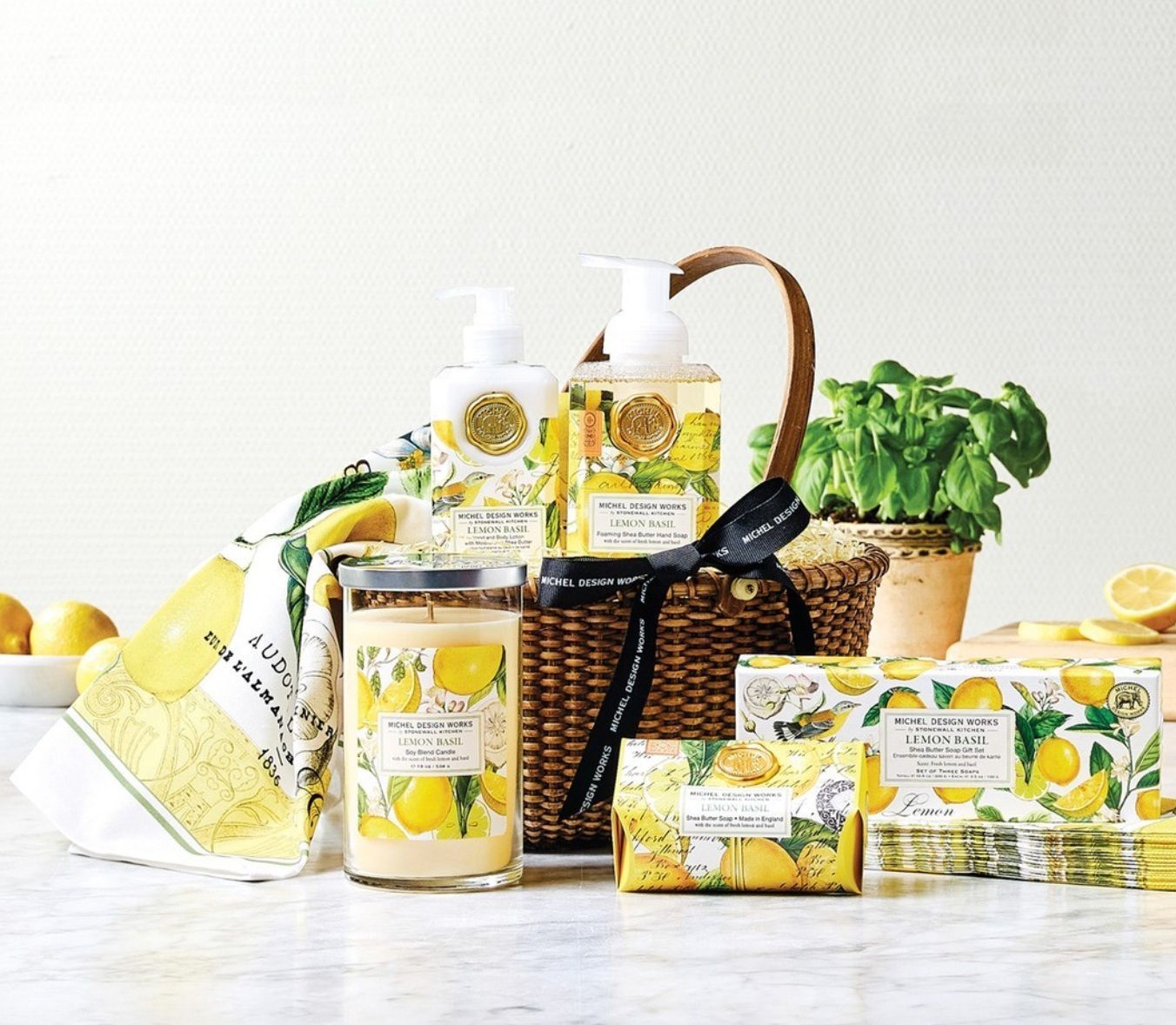 A basket filled with soaps and candles with lemons on them