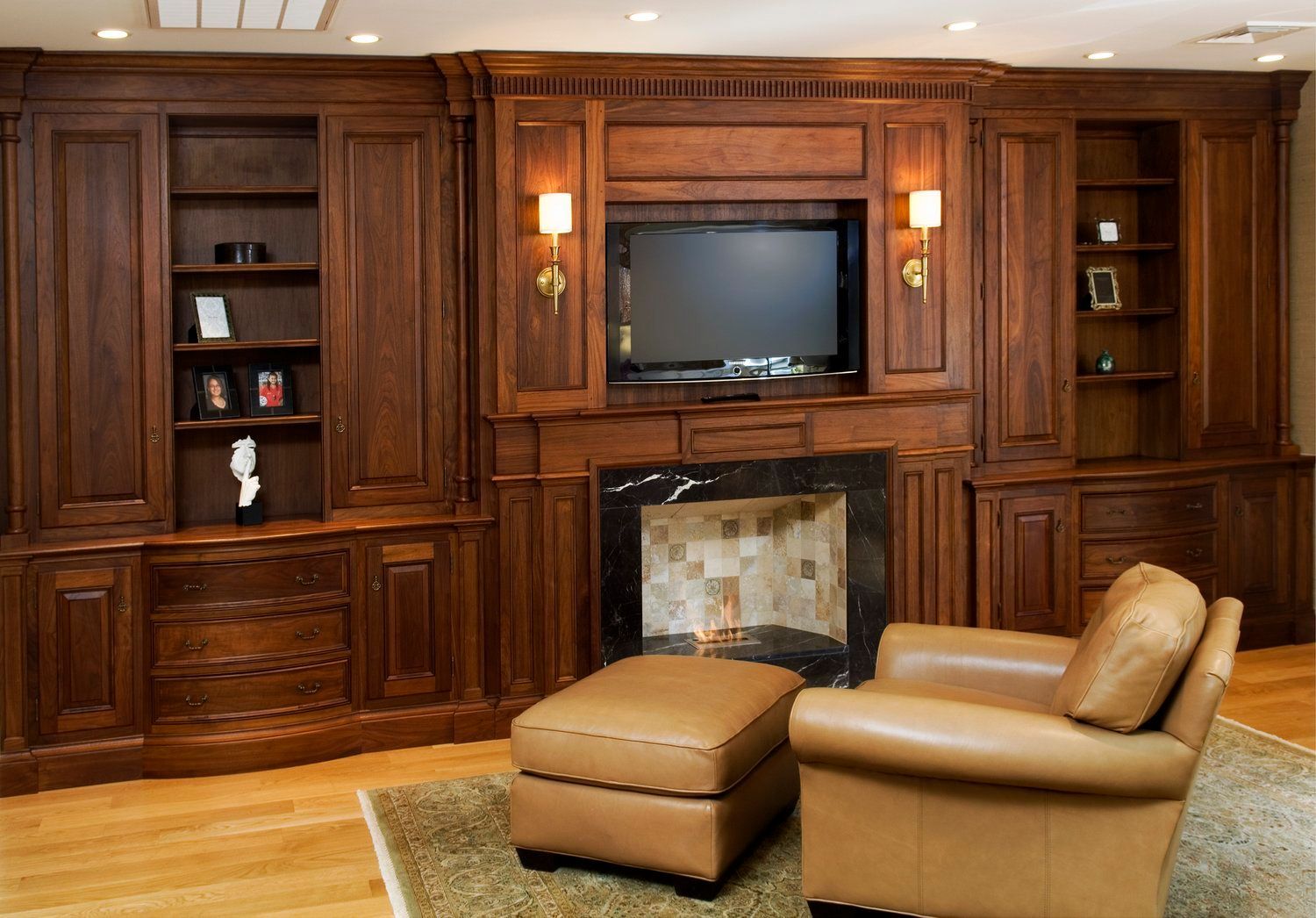 A living room with two chairs and a fireplace