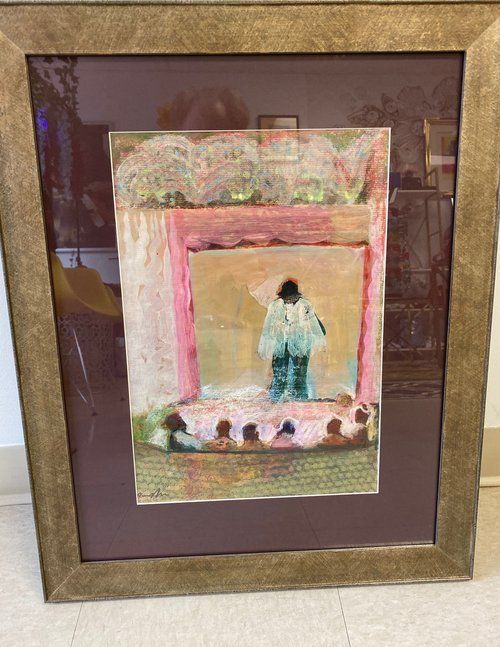A framed painting of a man standing on a stage