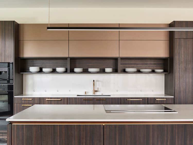 A kitchen with wooden cabinets and a white counter top