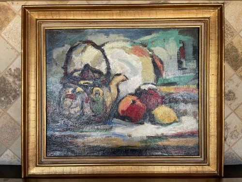 A painting of a teapot , apples , and lemons in a gold frame.
