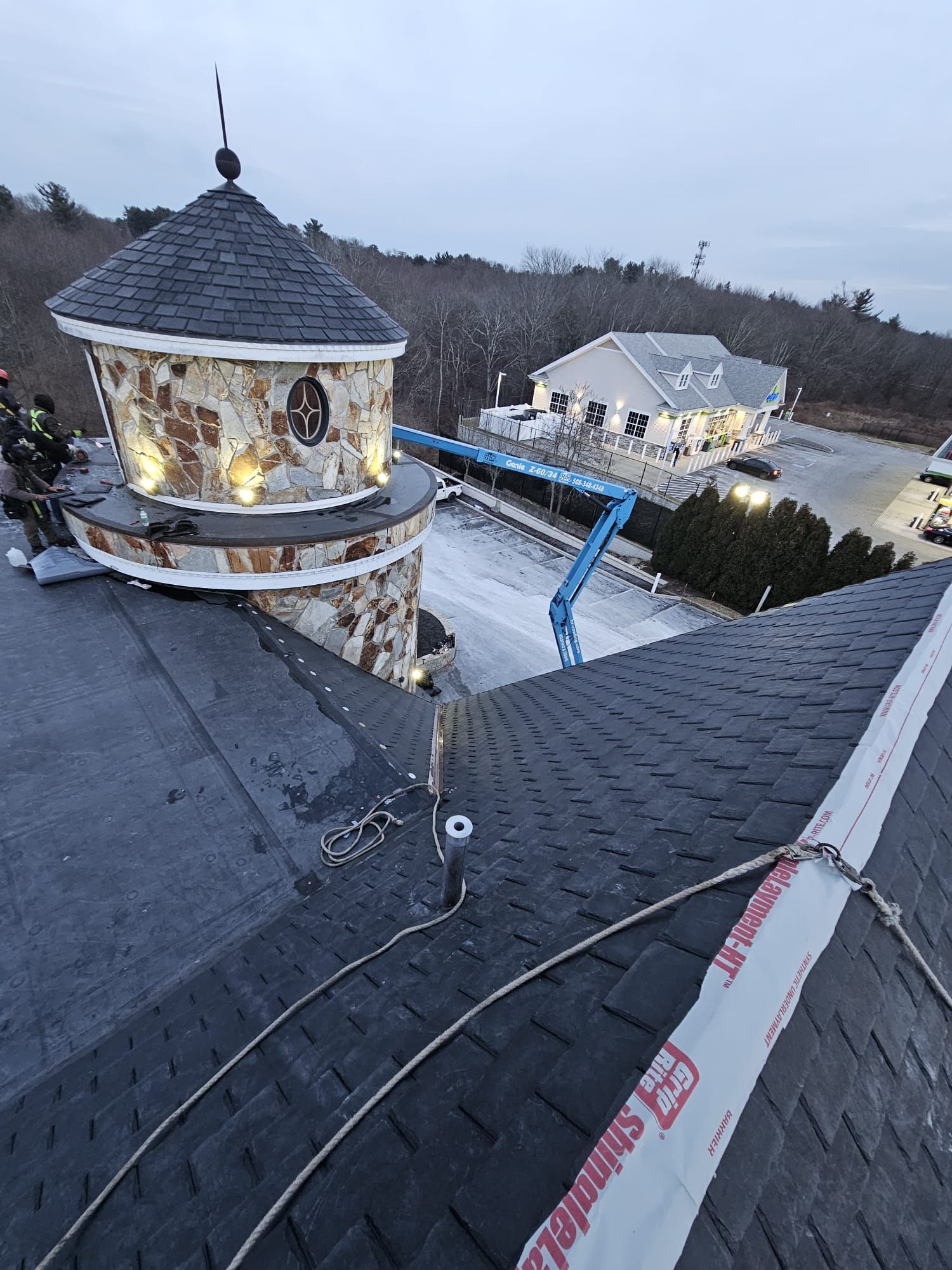 An aerial view of a roof with a tower on top of it.