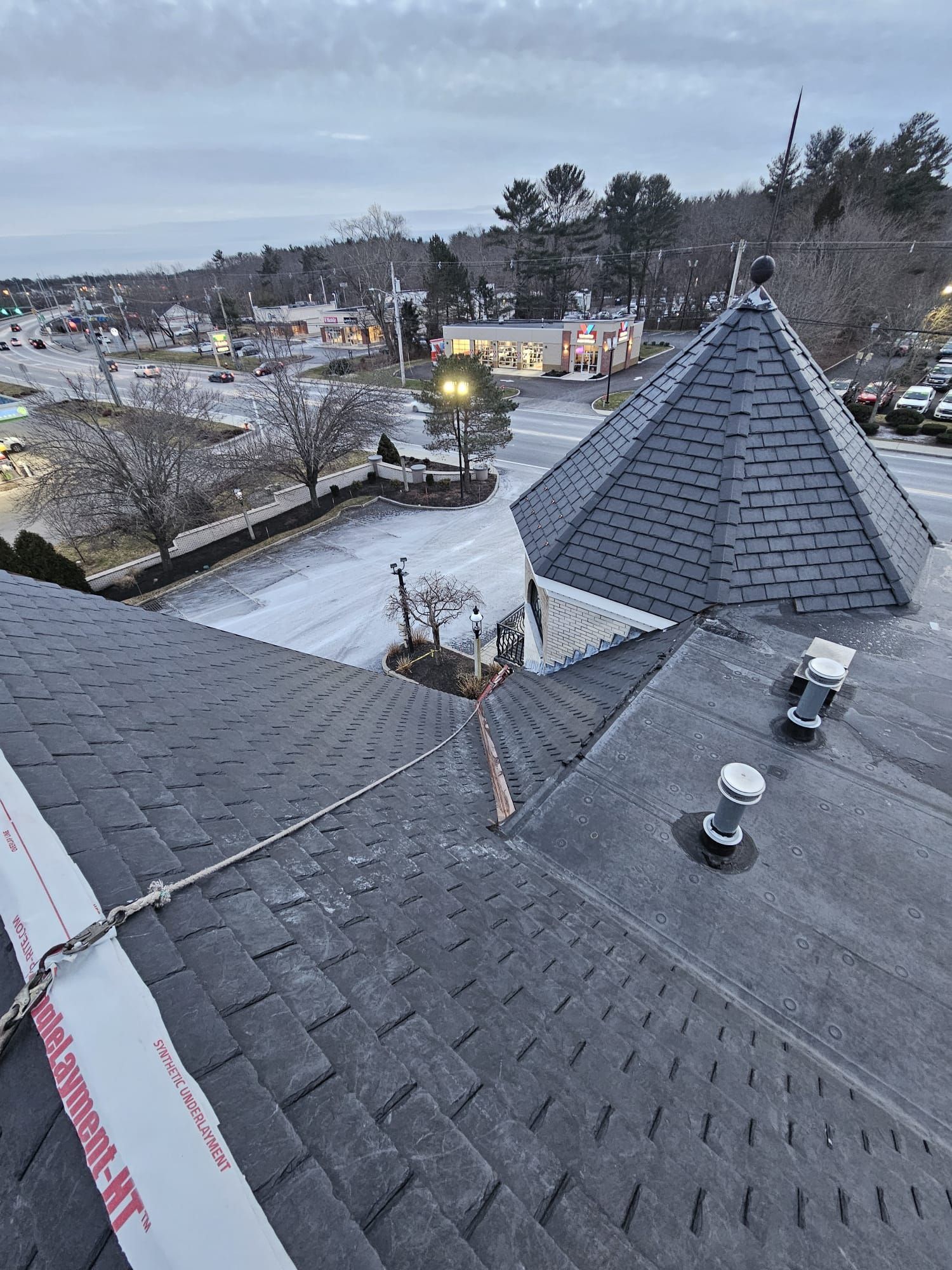 An aerial view of a roof with a pyramid shaped roof.