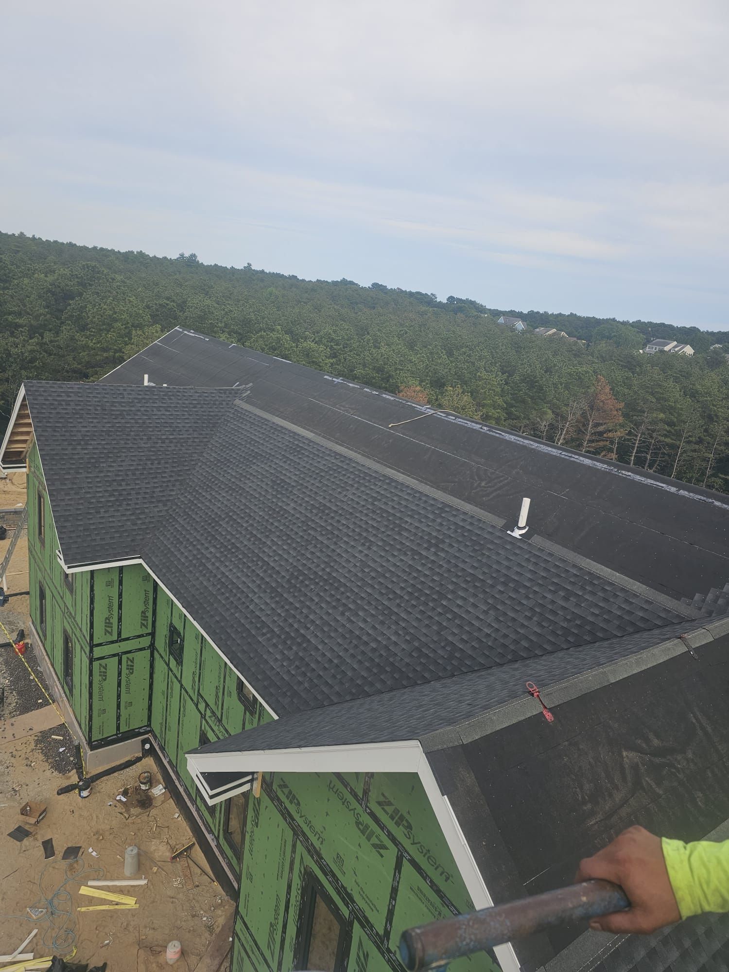 A person is working on the roof of a building