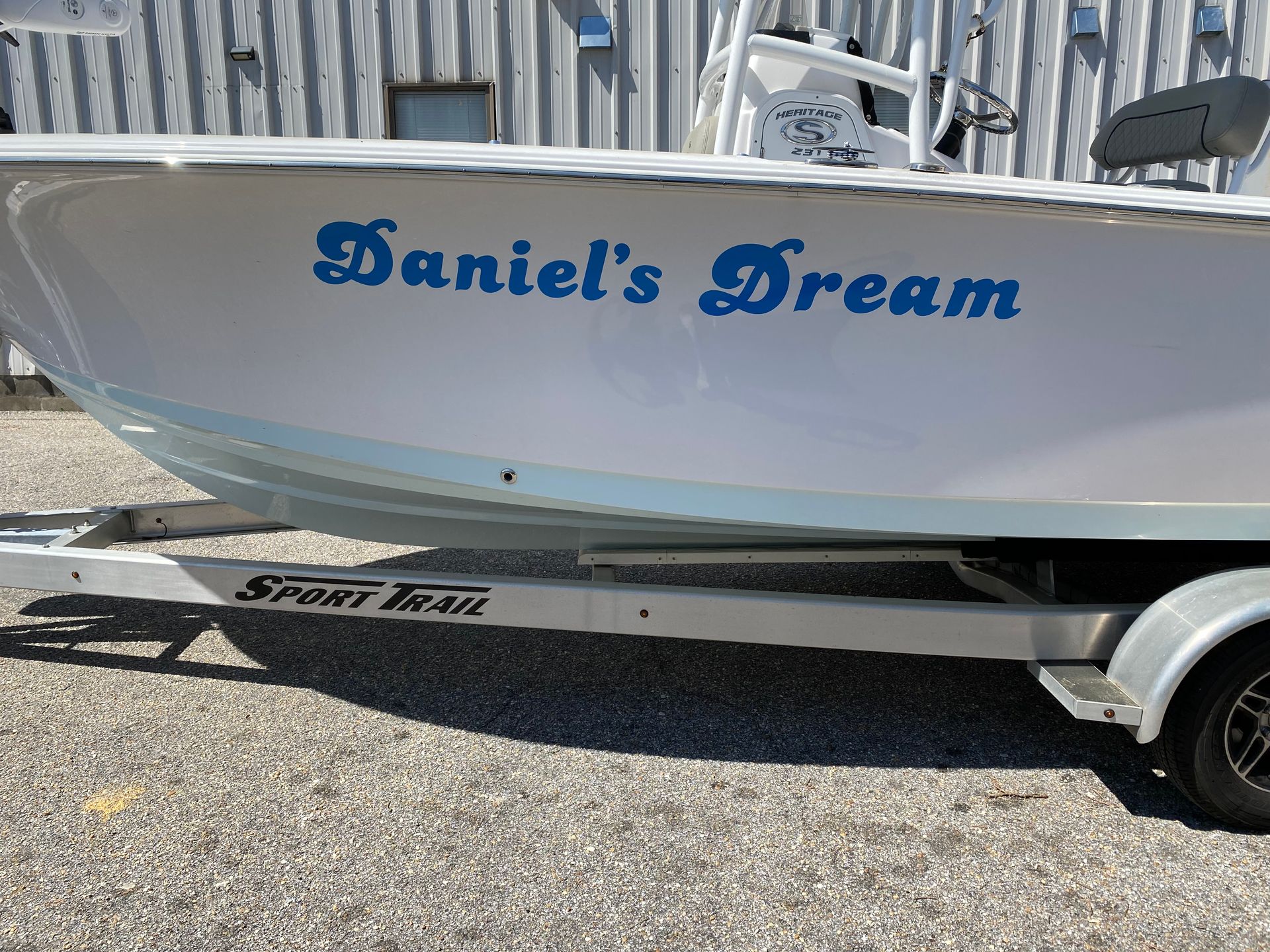 A boat with the name daniel 's dream on it