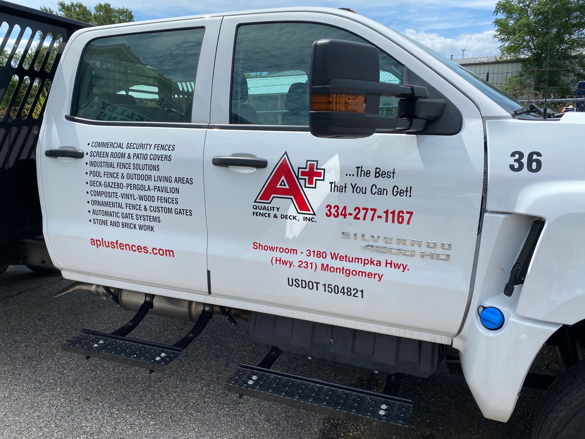 A white truck with the number 36 on it