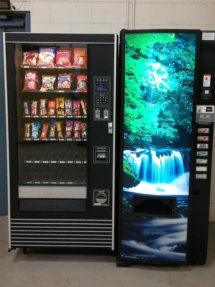 A vending machine with a waterfall on it