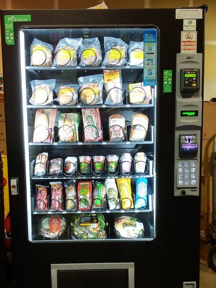 A vending machine filled with a variety of food items
