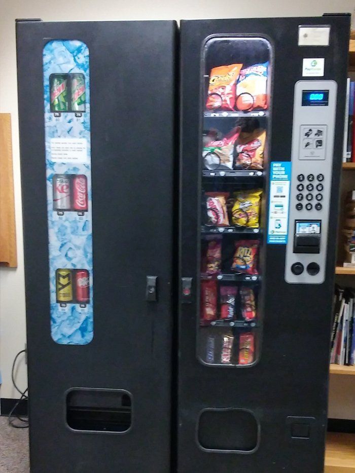 A vending machine that sells soda and chips
