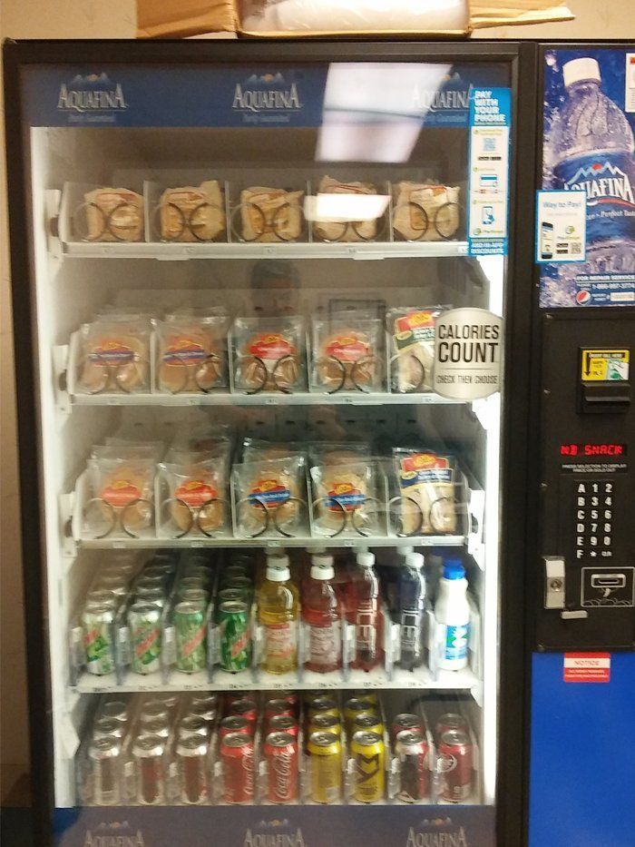 A vending machine with a sign that says calories count