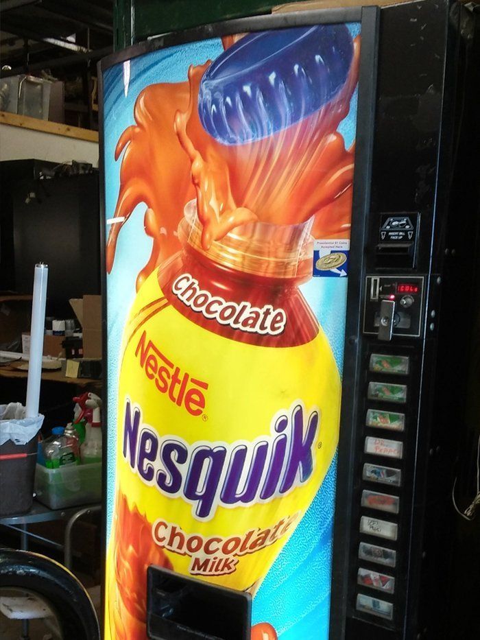 A vending machine that sells nestle nesquik chocolate milk