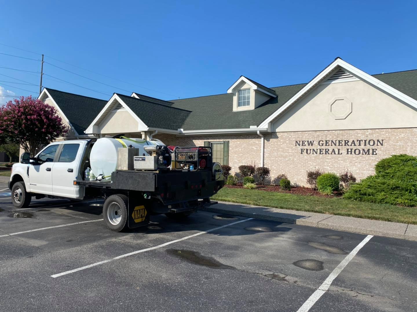 Company truck and funeral house