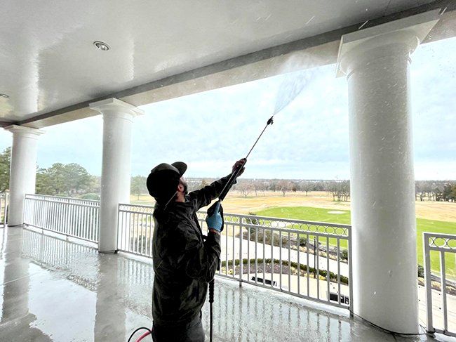 Staff doing pressure washing