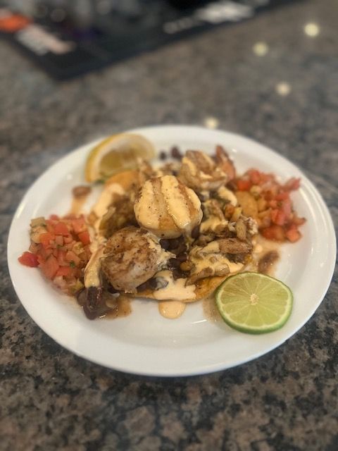 Seafood Tostada with Scallop, Crab, Shrimp, Black Beans, Sriracha Aioli, Pico De Gallo, and Lime