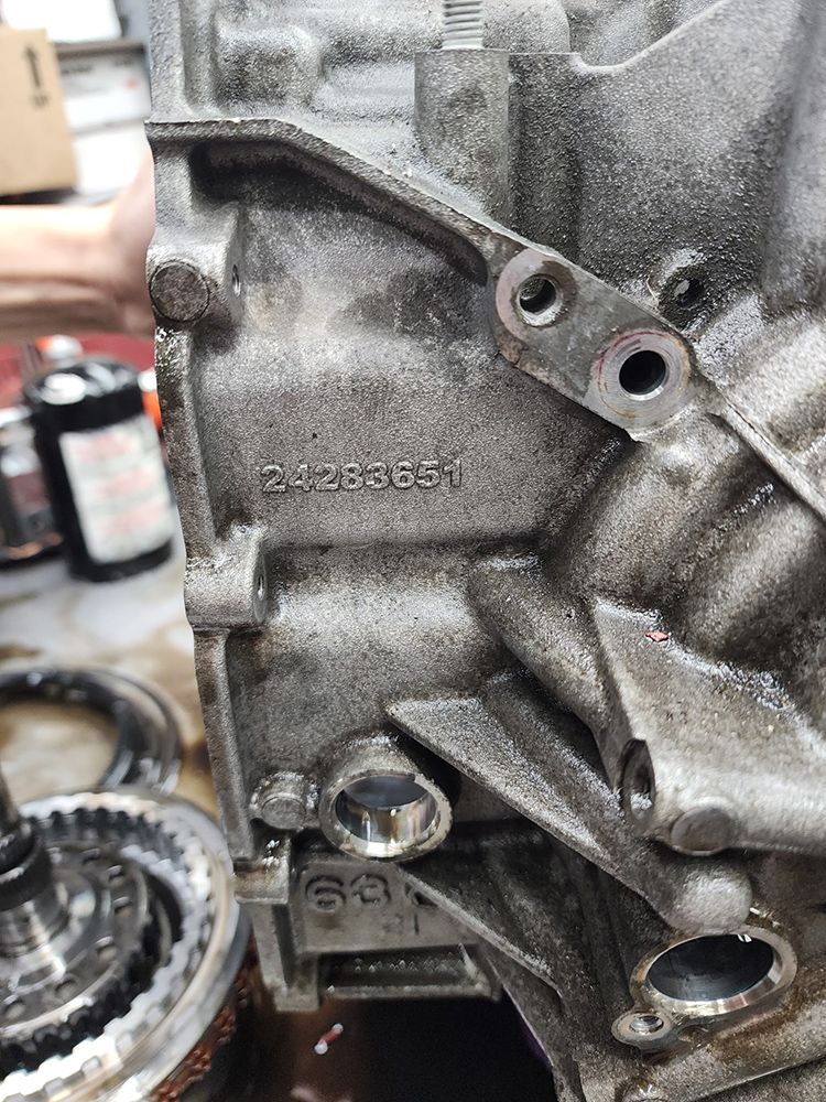 Close-up of a transmission housing, showing the stamped number 