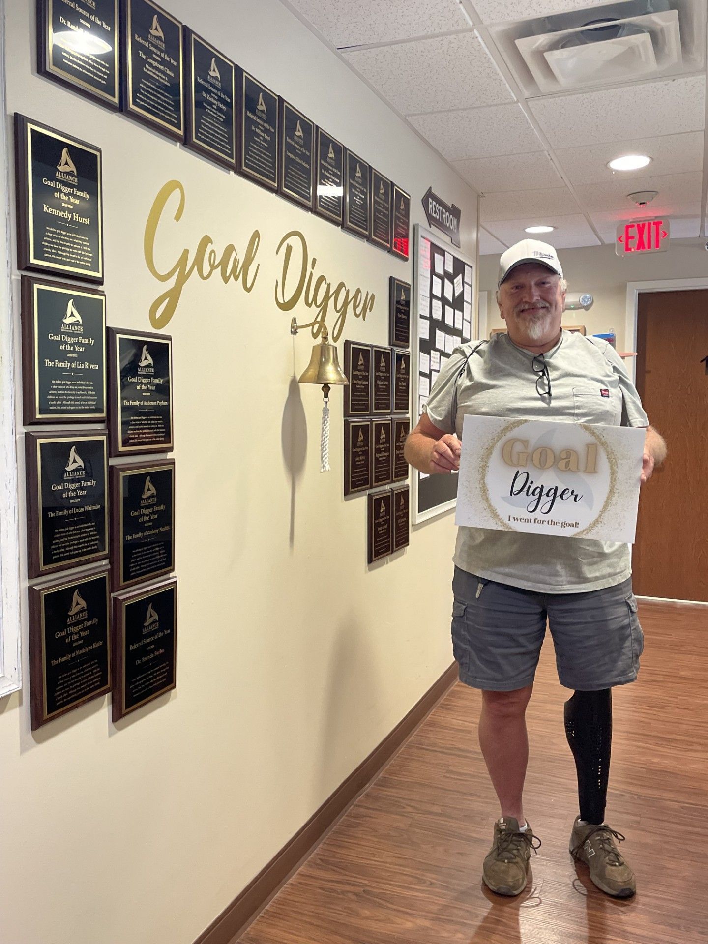 Man with prosthetic leg holds 