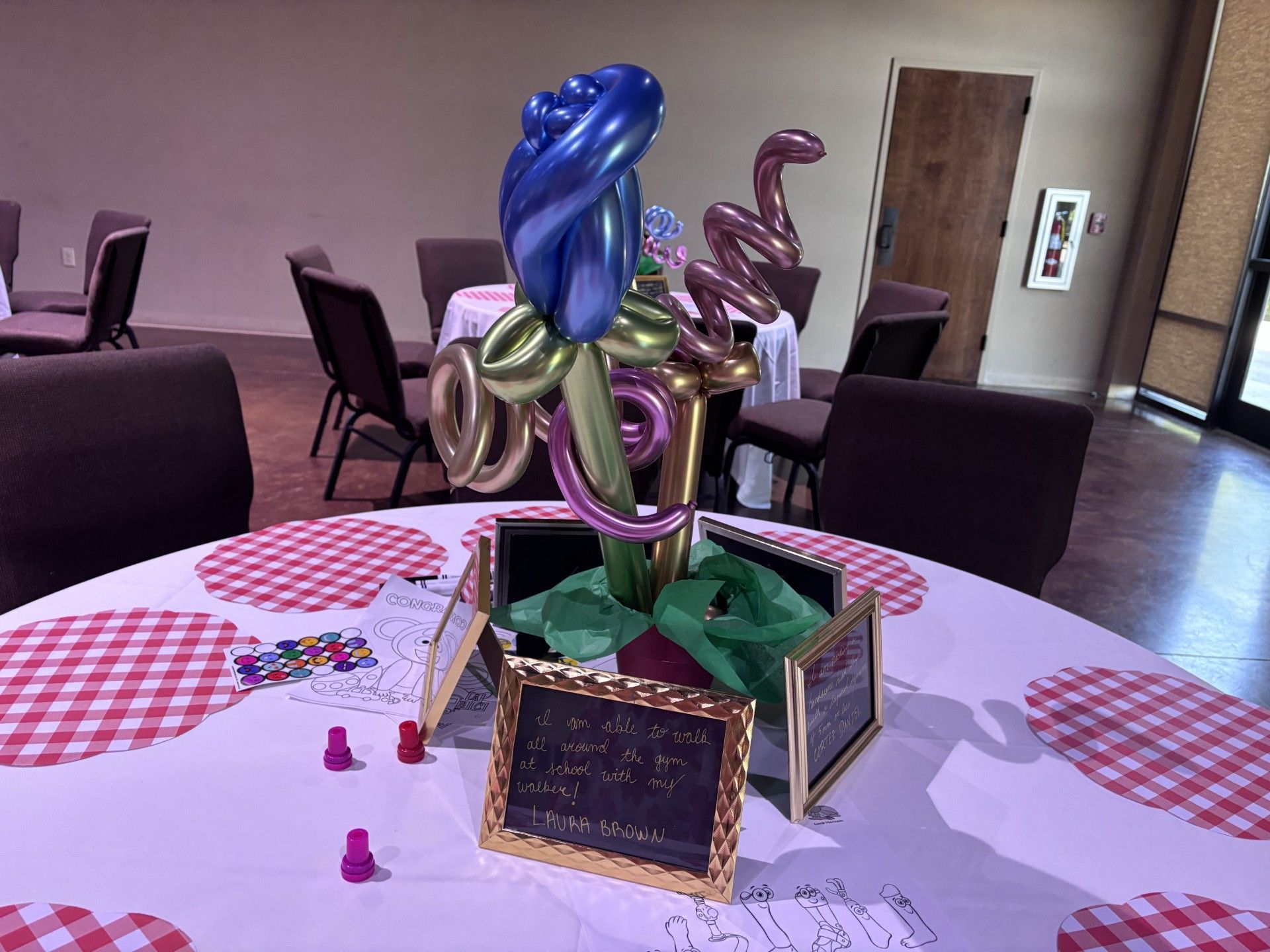 Decorative balloon centerpiece on a table in a banquet room