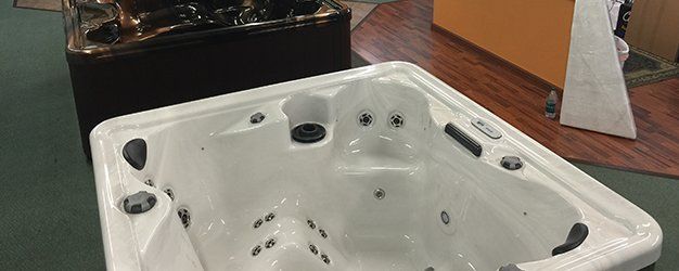 a marquis hot tubs displayed in the showroom