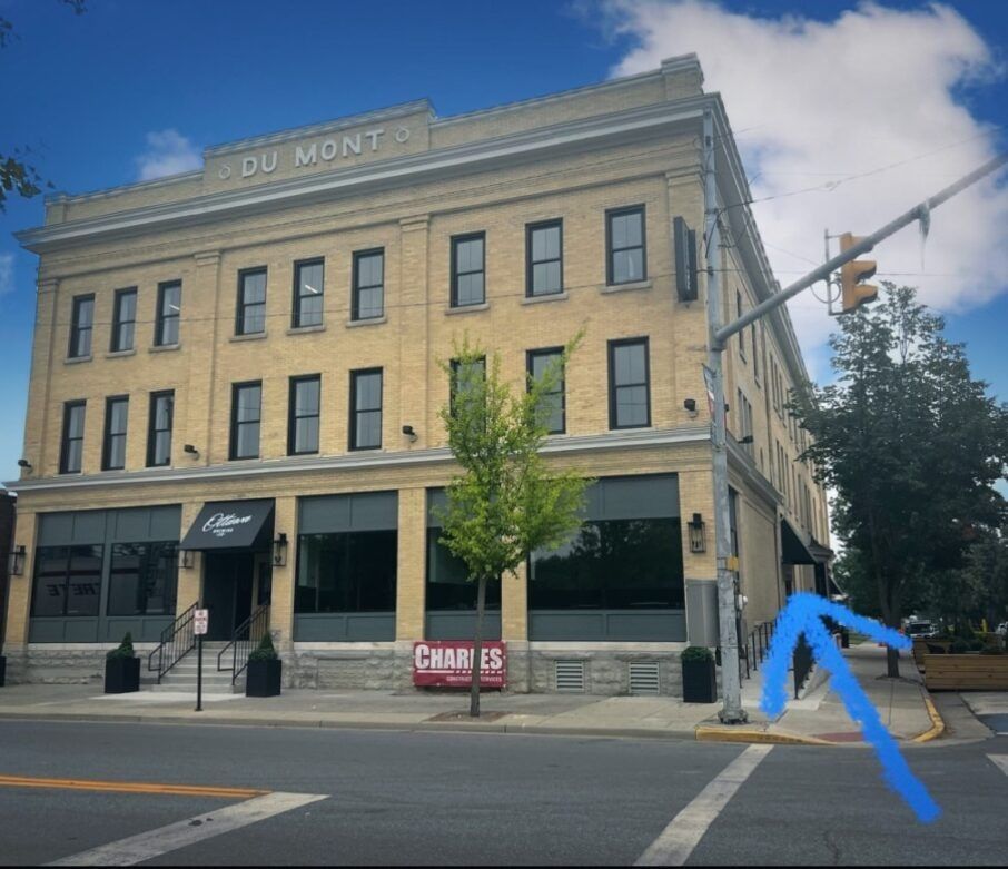 A large brick building with du mont written on the top