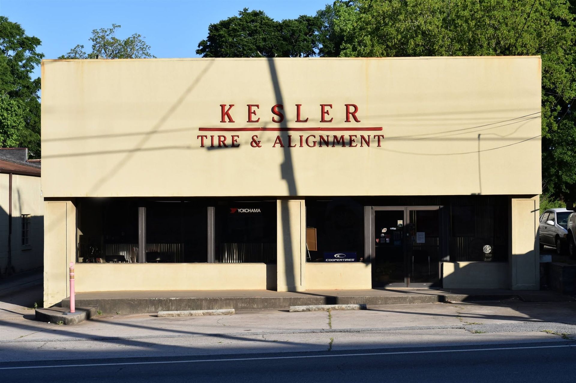 Kesler Tire & Alignment storefront with beige facade and large front windows