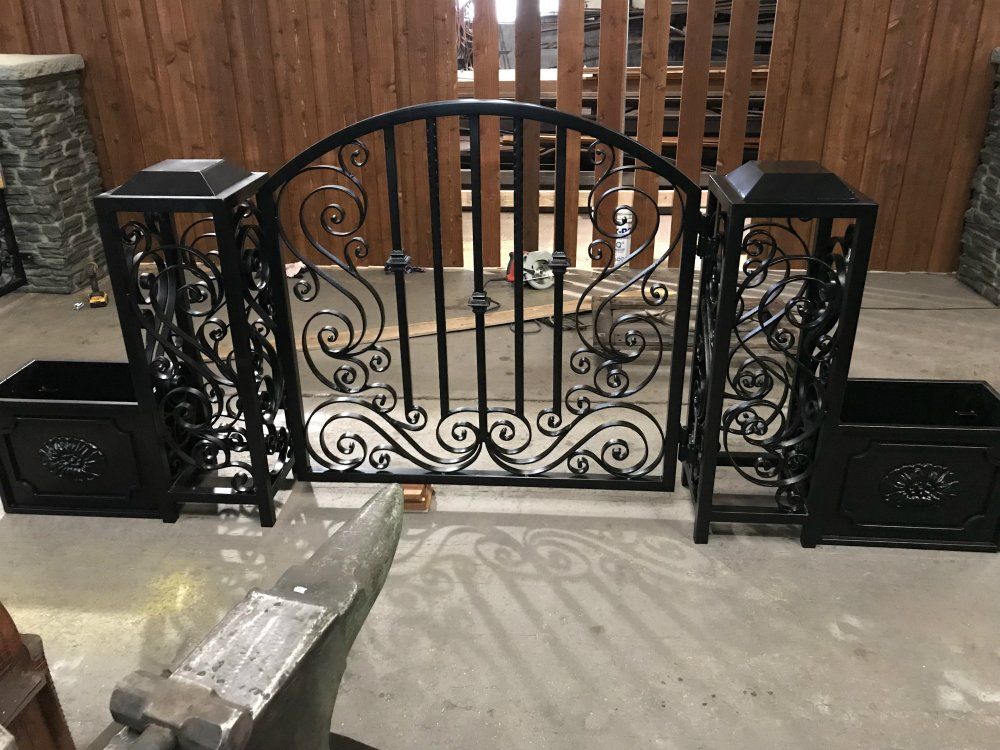 Ornamental iron fencing gate