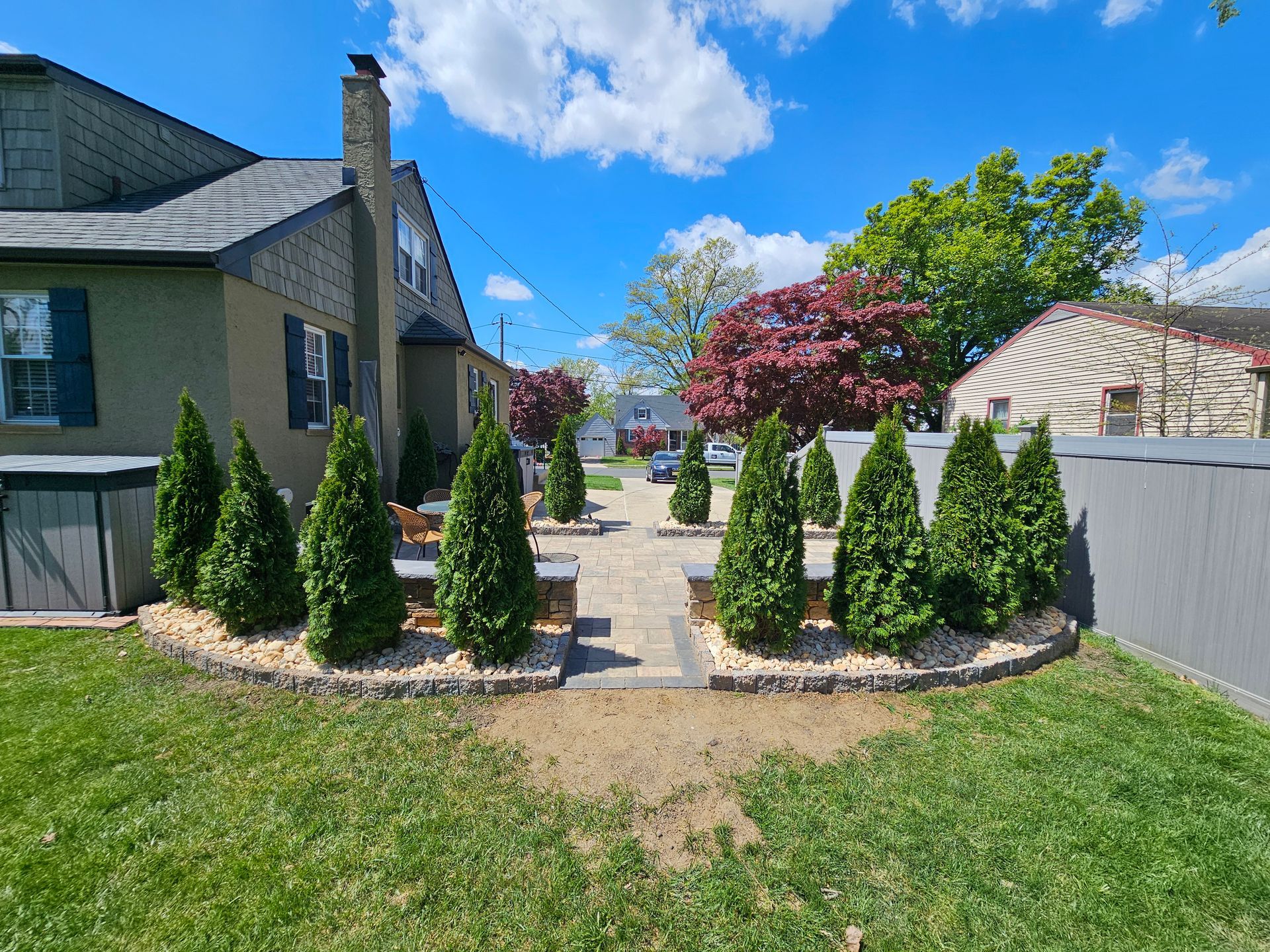 A house with a lot of trees in front of it