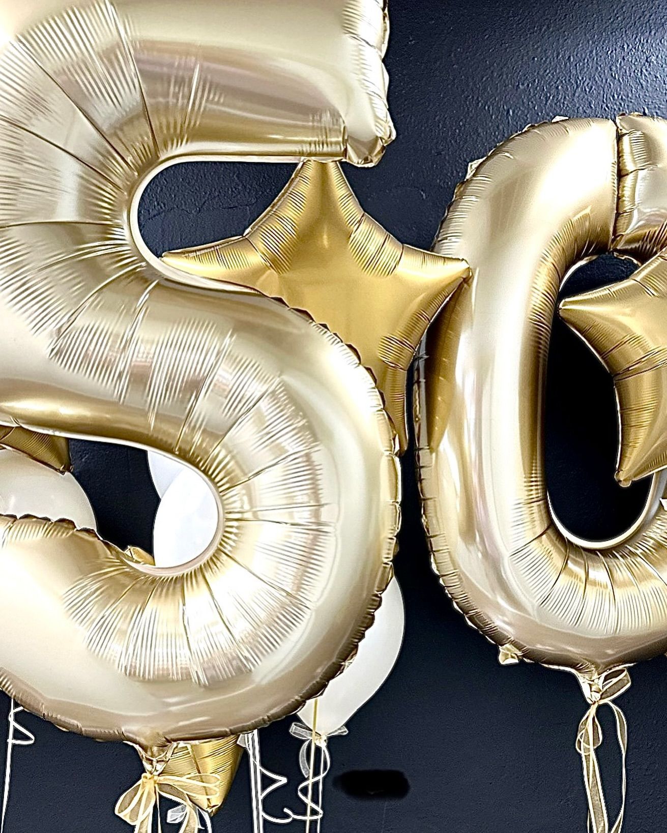 A bunch of balloons in the shape of the number 50