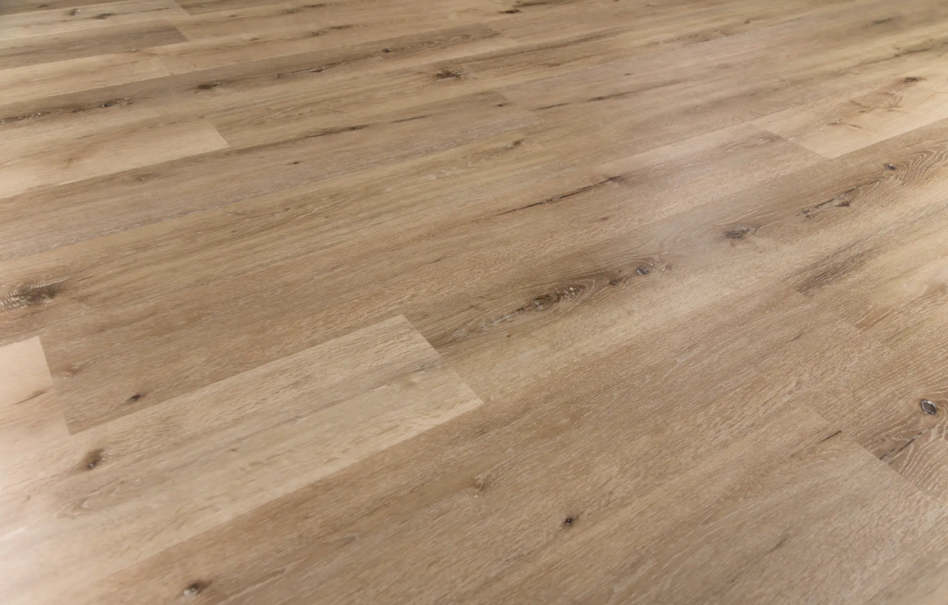 A close up of a wooden floor with a grainy texture.