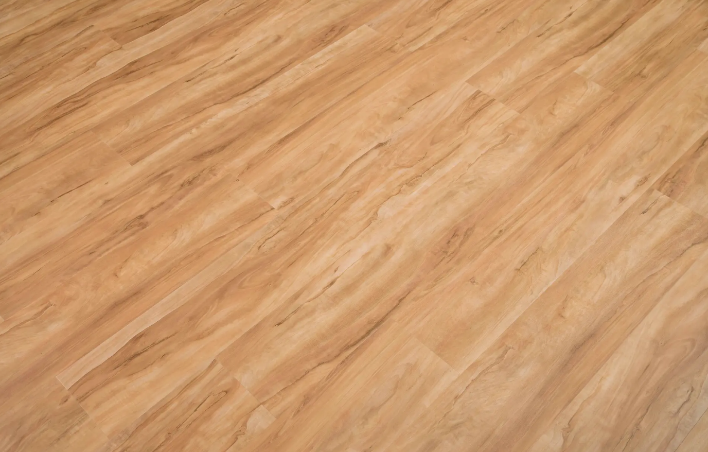 A close up of a wooden floor with a marble texture.