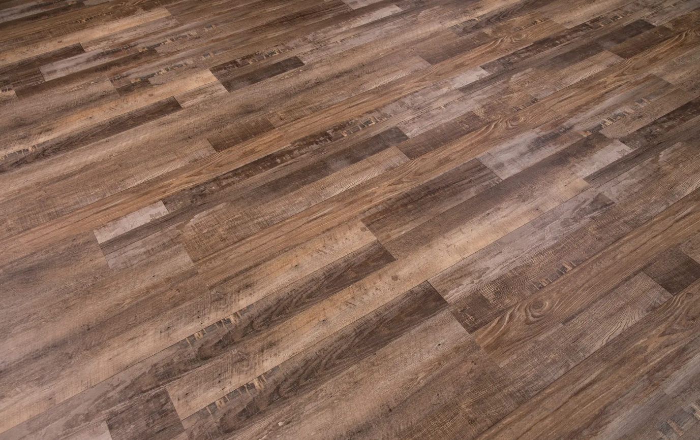 A close up of a wooden floor with a pattern on it.