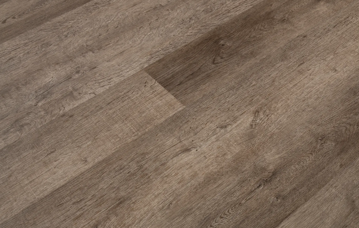 A close up of a wooden floor in a room.
