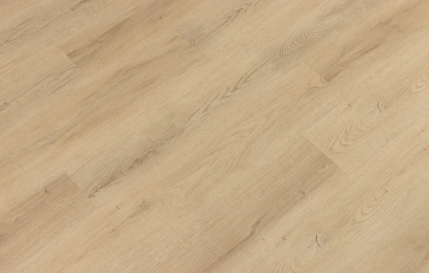 A close up of a wooden floor with a diagonal pattern.