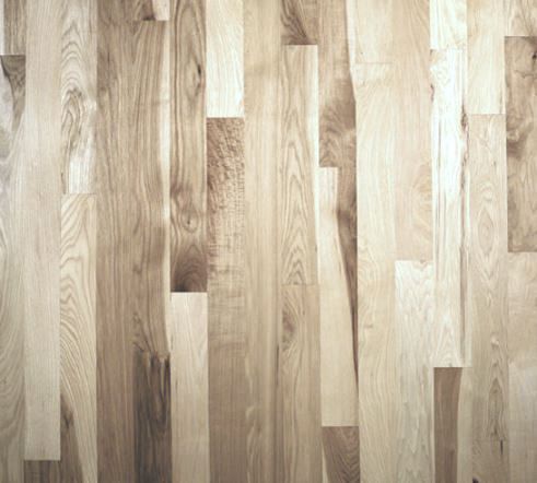 A close up of a wooden floor with a lot of grain.