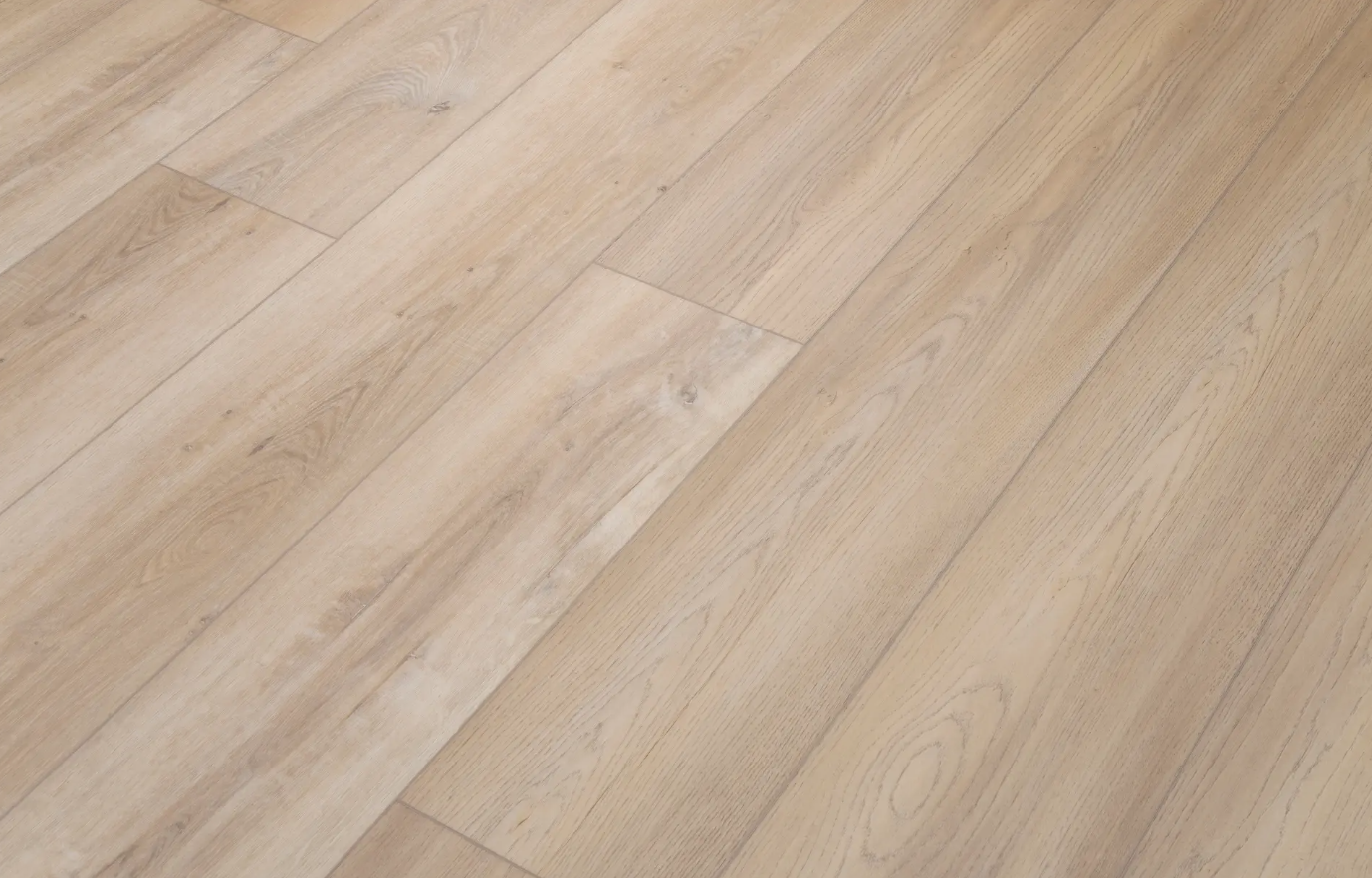 A close up of a light brown wooden floor.