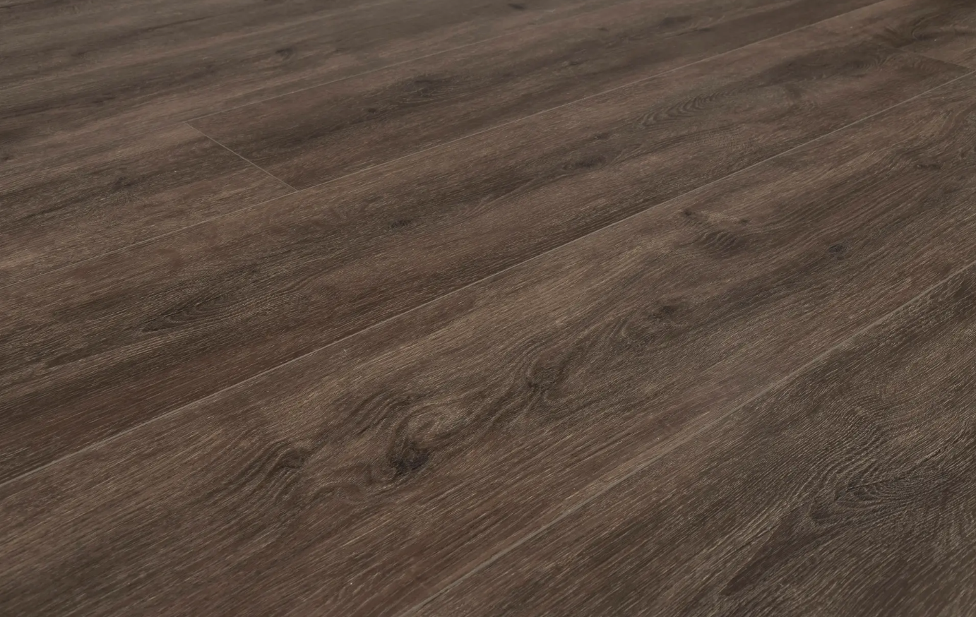 A close up of a brown wooden floor.